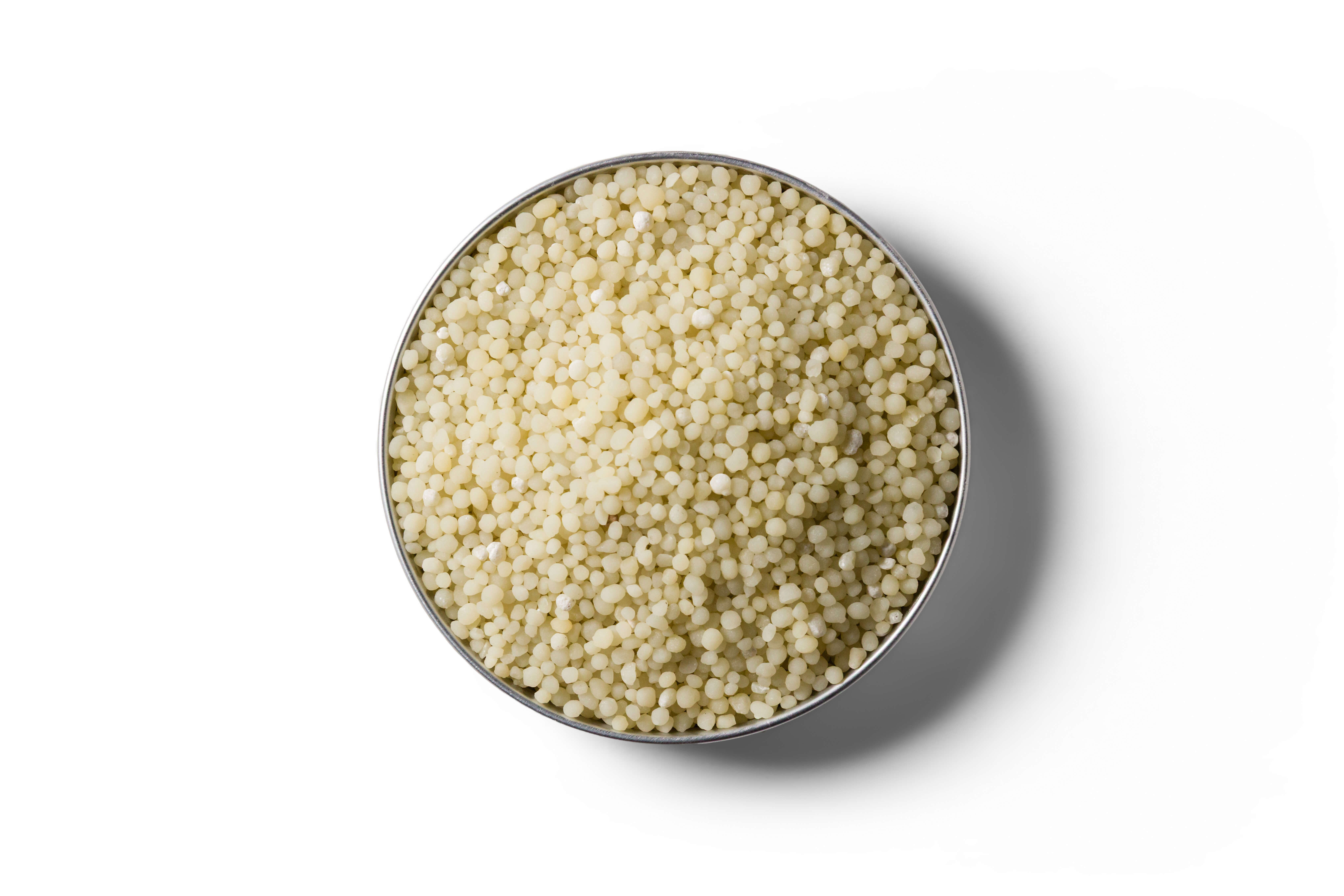 Light yellow Cropmaster DAP fertiliser granules in a round dish