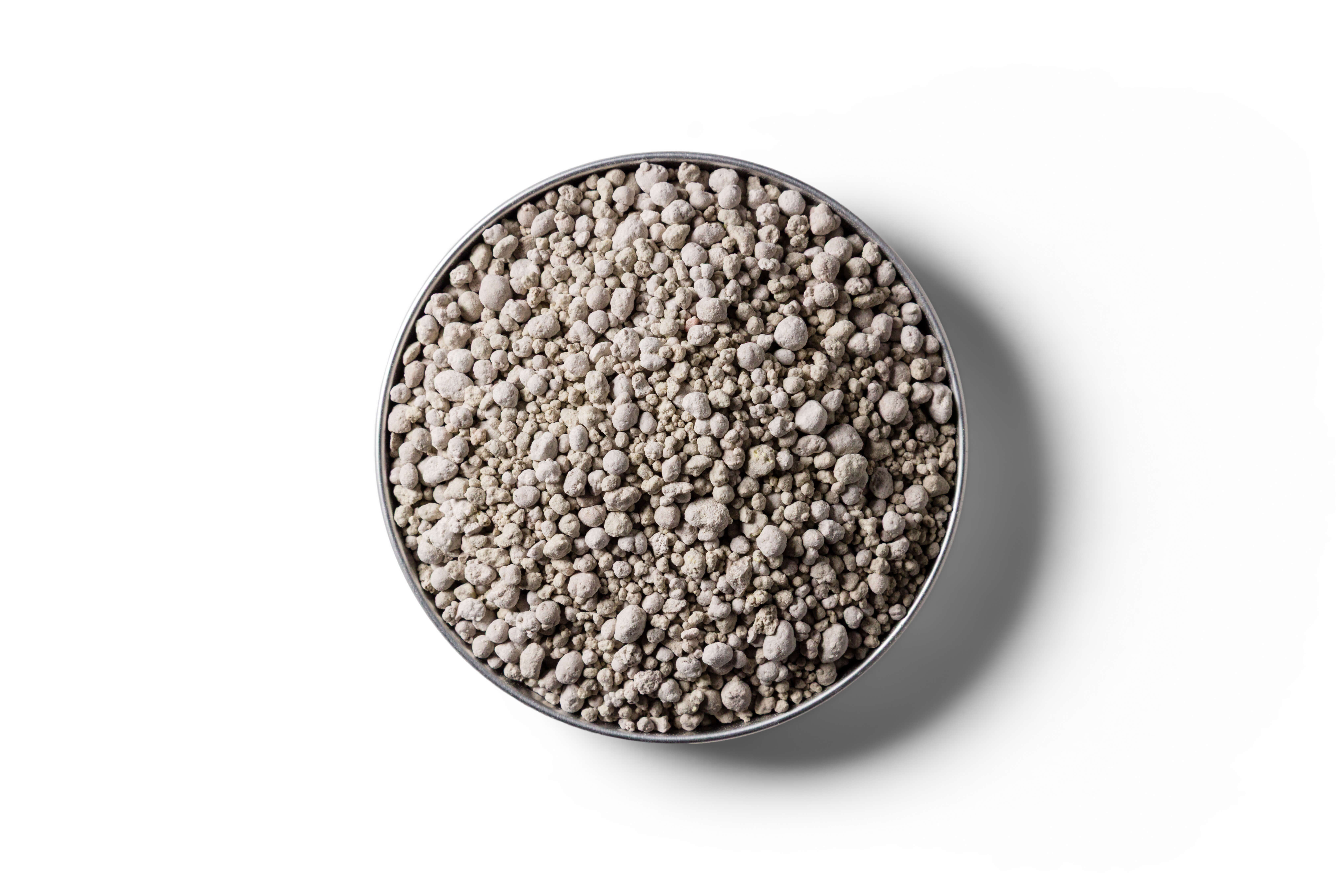 Sulphur Super 15 fertiliser granules in a round dish